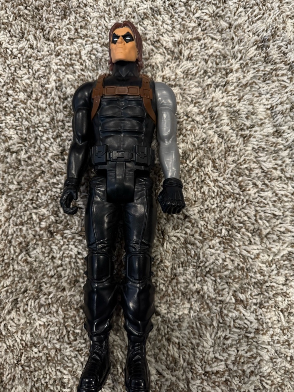 Black Action Figure with Brown Harness and Gray Left Arm